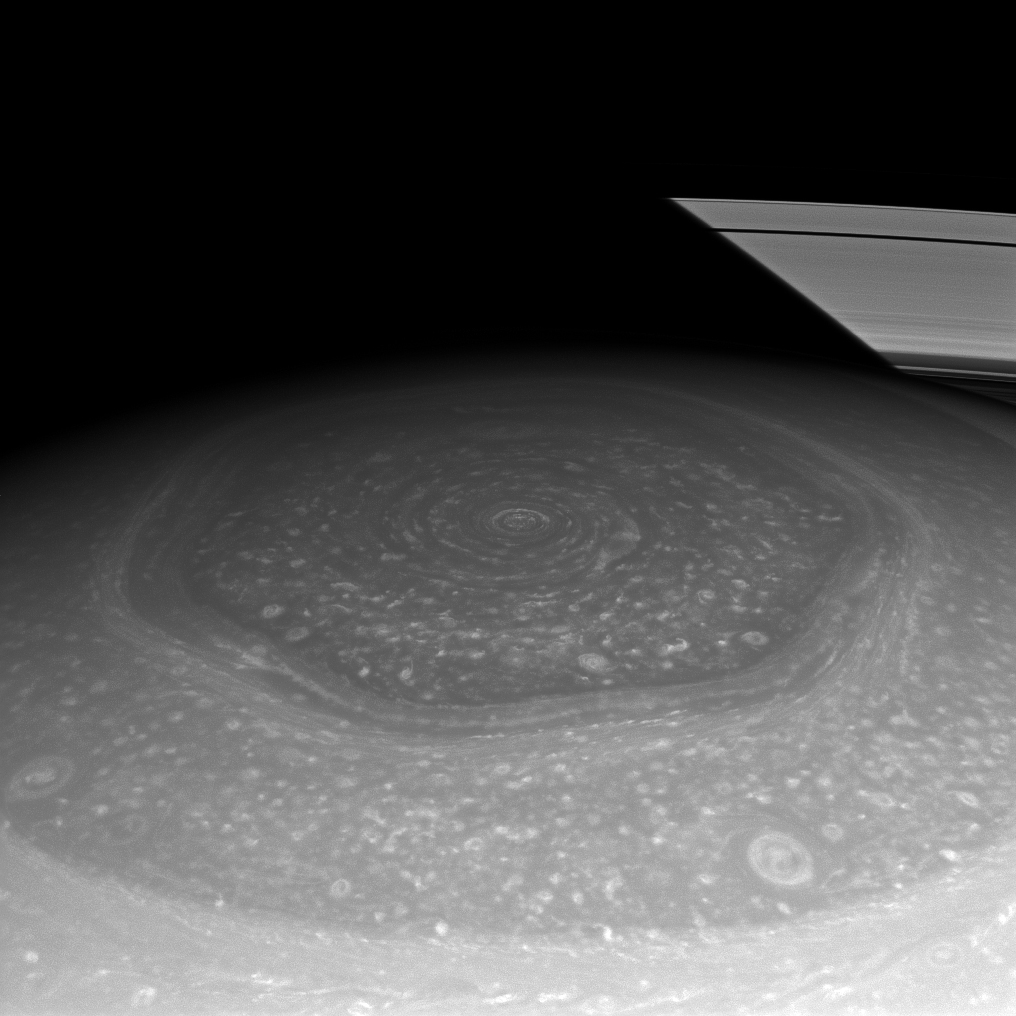 Saturn's remarkable hexagonal cloud pattern at the north pole, showing geometric vortex formation